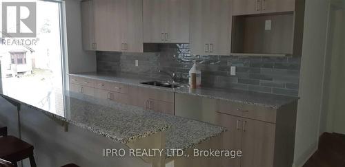 101 - 1 Falaise Road, Toronto, ON - Indoor Photo Showing Kitchen With Double Sink