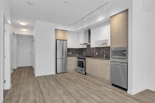 103-1800 Richter Street, Kelowna, BC - Indoor Photo Showing Kitchen With Stainless Steel Kitchen