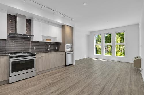 103-1800 Richter Street, Kelowna, BC - Indoor Photo Showing Kitchen With Stainless Steel Kitchen