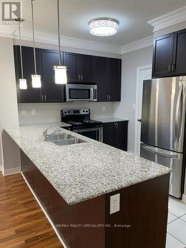 413 - 383 Main Street E, Milton, ON - Indoor Photo Showing Kitchen With Double Sink With Upgraded Kitchen