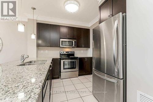 413 - 383 Main Street E, Milton, ON - Indoor Photo Showing Kitchen With Double Sink With Upgraded Kitchen