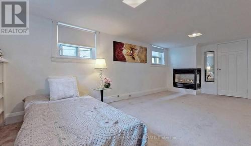 37 Regina Avenue, Toronto, ON - Indoor Photo Showing Bedroom With Fireplace