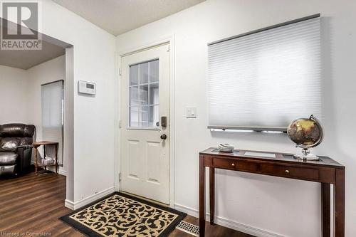 Foyer entrance with a textured ceiling and dark hardwood / wood-style floors - 9 Adam Street, Cambridge, ON 