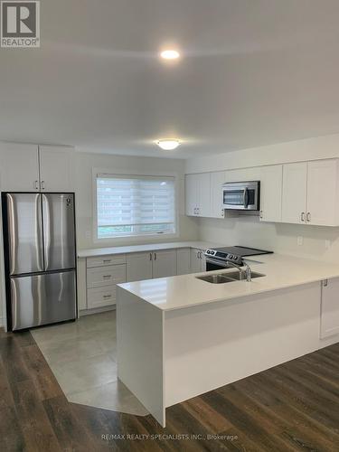 3 - 175-177 Russell Avenue, St. Catharines, ON - Indoor Photo Showing Kitchen With Double Sink