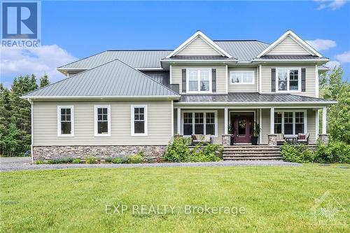 10385 Shaw Road, North Dundas, ON - Outdoor With Deck Patio Veranda With Facade