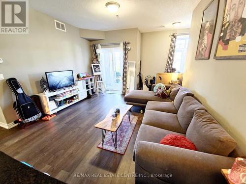 110 - 1360 Costigan Road, Milton, ON - Indoor Photo Showing Living Room