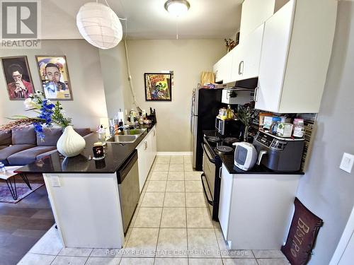 110 - 1360 Costigan Road, Milton, ON - Indoor Photo Showing Kitchen With Double Sink