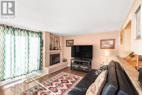 2 - 2052 Brant Street, Burlington, ON - Indoor Photo Showing Living Room With Fireplace