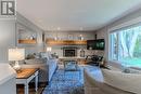 48 Lawrence Avenue, Springwater, ON  - Indoor Photo Showing Living Room With Fireplace 