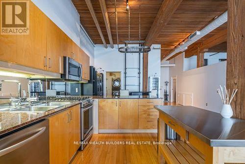 417 - 993 Queen Street W, Toronto, ON - Indoor Photo Showing Kitchen With Double Sink