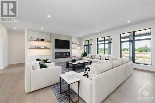 3987 Perennial Way, Greely, ON - Indoor Photo Showing Living Room With Fireplace