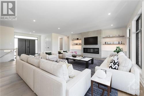 3987 Perennial Way, Greely, ON - Indoor Photo Showing Living Room With Fireplace