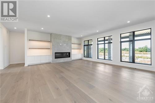 3987 Perennial Way, Greely, ON - Indoor Photo Showing Living Room With Fireplace