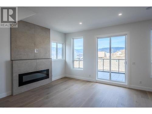 3304 Evergreen Drive, Penticton, BC - Indoor Photo Showing Living Room With Fireplace