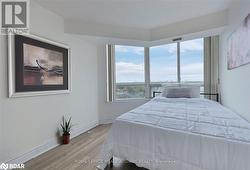 Bedroom featuring wood-type flooring and a textured ceiling - 