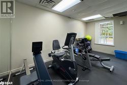 Gym featuring a paneled ceiling - 