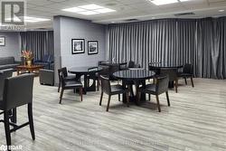 Dining area featuring a drop ceiling and light hardwood / wood-style flooring - 