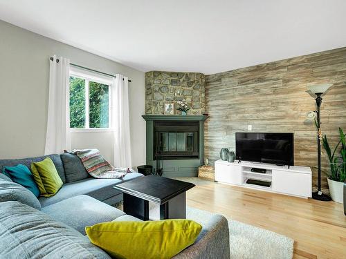 Living room - 42 Av. Carmen, Saint-Sauveur, QC - Indoor Photo Showing Living Room With Fireplace