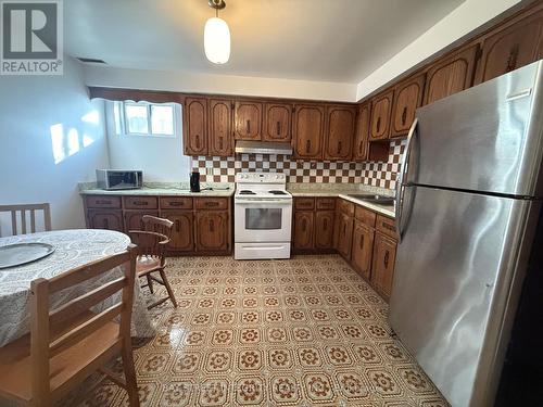 Bsmt - 34 Iangrove Terrace, Toronto, ON - Indoor Photo Showing Kitchen With Double Sink