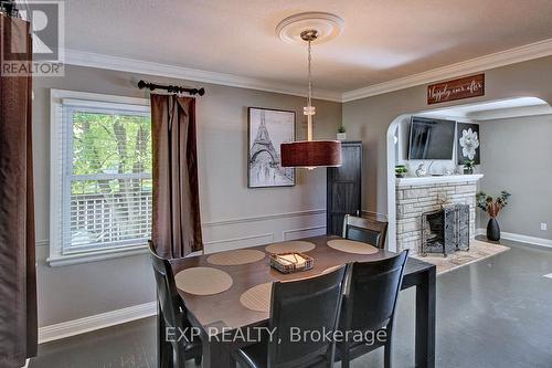 1341 Byron Baseline Road, London, ON - Indoor Photo Showing Dining Room With Fireplace