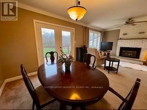 5576 Fawn Bay Road, Ramara, ON - Indoor Photo Showing Dining Room With Fireplace