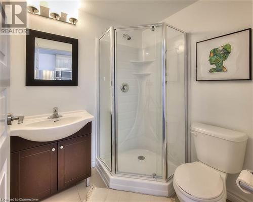 Bathroom featuring tile patterned floors, vanity, toilet, and a shower with door - 160 King Street N Unit# 901, Waterloo, ON - Indoor Photo Showing Bathroom