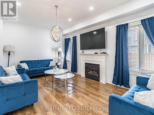 1051 Mcclenahan Crescent, Milton, ON - Indoor Photo Showing Living Room With Fireplace