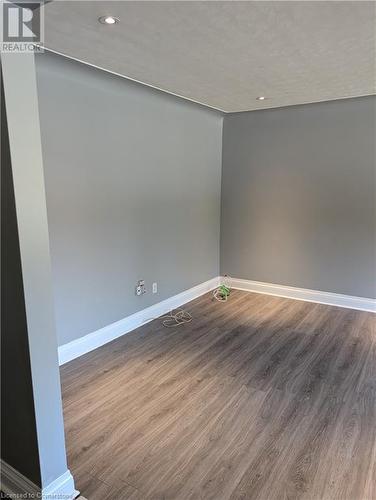 Empty room featuring hardwood / wood-style flooring - 175 Oxford Street Unit# A, Kitchener, ON - Indoor Photo Showing Other Room