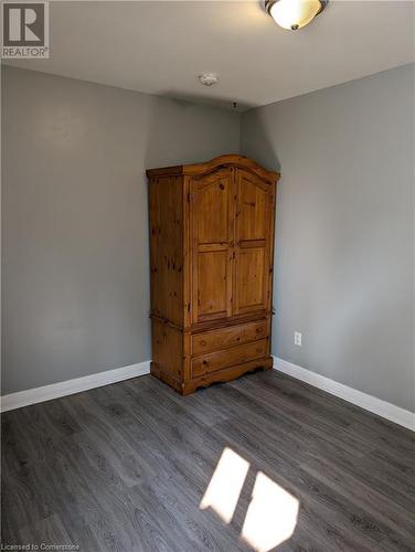 Unfurnished bedroom with dark hardwood / wood-style floors - 175 Oxford Street Unit# A, Kitchener, ON - Indoor