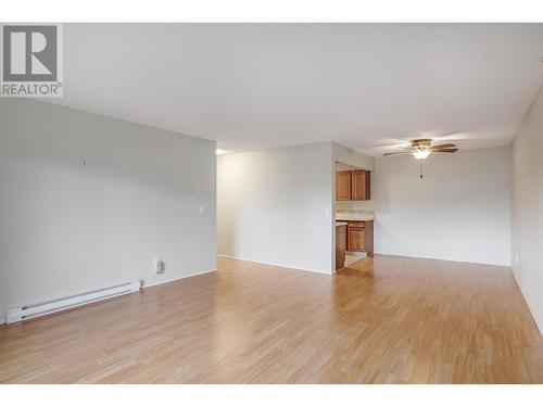 View from sunroom towards living, dining and kitchen areas - 2085 Gordon Drive Unit# 215, Kelowna, BC - Indoor Photo Showing Other Room