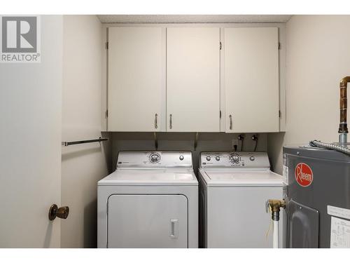 Enjoy the luxury of in-suite laundry with ample storage - 2085 Gordon Drive Unit# 215, Kelowna, BC - Indoor Photo Showing Laundry Room