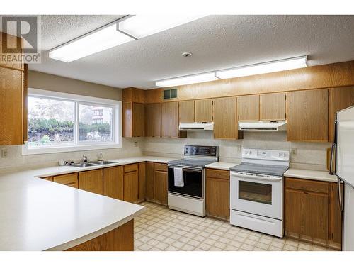 Social room kitchen - 2085 Gordon Drive Unit# 215, Kelowna, BC - Indoor Photo Showing Kitchen With Double Sink