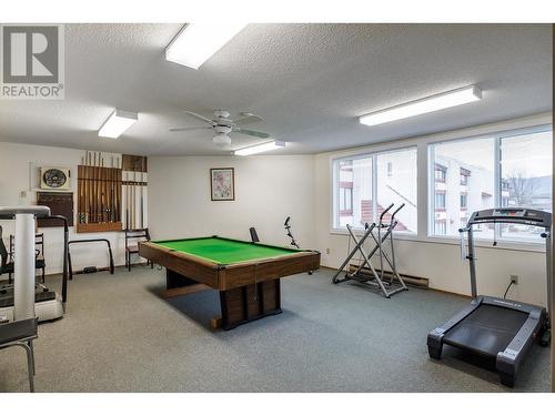 Activities room complete with pool table and exercise room - 2085 Gordon Drive Unit# 215, Kelowna, BC - Indoor Photo Showing Gym Room