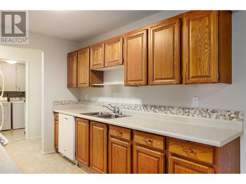 Galley style kitchen - 2085 Gordon Drive Unit# 215, Kelowna, BC - Indoor Photo Showing Kitchen With Double Sink