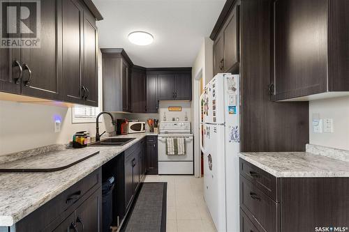 15A & 15B Erixon Place, Clavet, SK - Indoor Photo Showing Kitchen With Double Sink