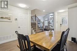 Dining space featuring a textured ceiling and hardwood / wood-style flooring - 