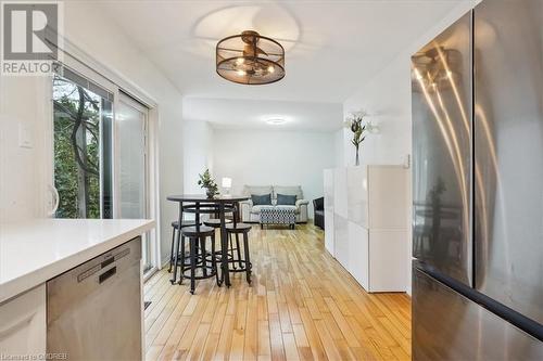 Kitchen with light hardwood / wood-style floors and stainless steel appliances - 5021 Bunton Crescent, Burlington, ON - Indoor