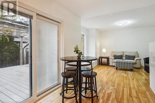 Dining space with a healthy amount of sunlight and light wood-type flooring - 5021 Bunton Crescent, Burlington, ON - Indoor