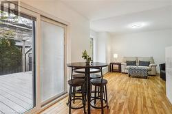 Dining space with a healthy amount of sunlight and light wood-type flooring - 