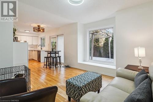 Living room featuring light hardwood / wood-style flooring, plenty of natural light, and sink - 5021 Bunton Crescent, Burlington, ON - Indoor Photo Showing Living Room