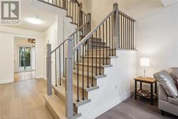 Staircase featuring hardwood / wood-style floors - 