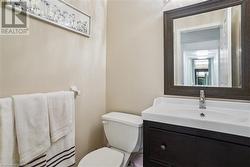 Bathroom with vanity and toilet - 