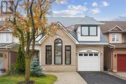 View of front of property featuring a garage - 