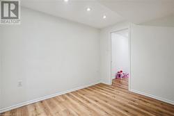 Unfurnished room with light hardwood / wood-style flooring - 