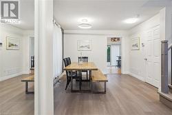 Dining room featuring hardwood / wood-style floors and a textured ceiling - 