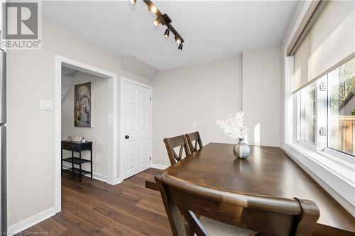 Dining room featuring dark hardwood / wood-style floors and track lighting - 305 East 24Th Street, Hamilton, ON - Indoor