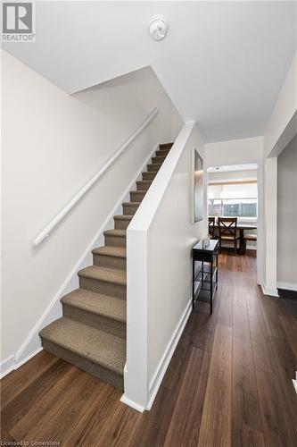 Staircase featuring hardwood / wood-style floors - 305 East 24Th Street, Hamilton, ON - Indoor Photo Showing Other Room