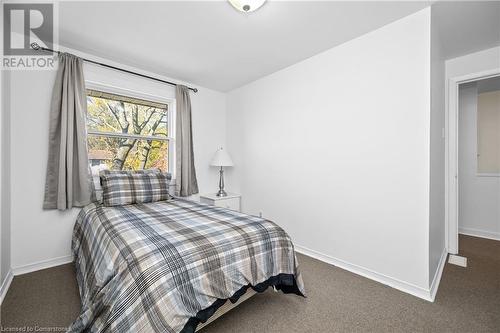 Bedroom featuring dark colored carpet - 305 East 24Th Street, Hamilton, ON - Indoor Photo Showing Bedroom