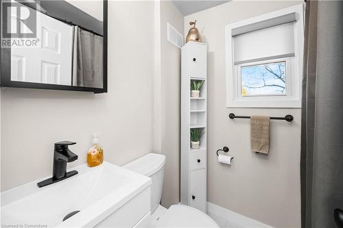 Bathroom featuring toilet and sink - 305 East 24Th Street, Hamilton, ON - Indoor Photo Showing Bathroom