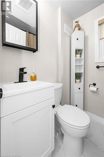 Bathroom featuring vanity and toilet - 305 East 24Th Street, Hamilton, ON - Indoor Photo Showing Bathroom